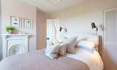 The stylish main bedroom on the first floor has wonderful sea views. - Thumbnail Image