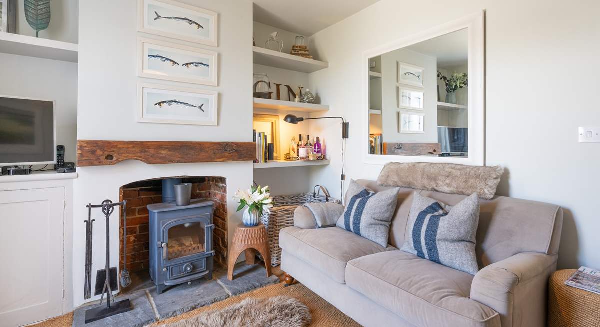 The beautifully decorated sitting-room, lie back and relax with the wood-burner crackling away in the background.