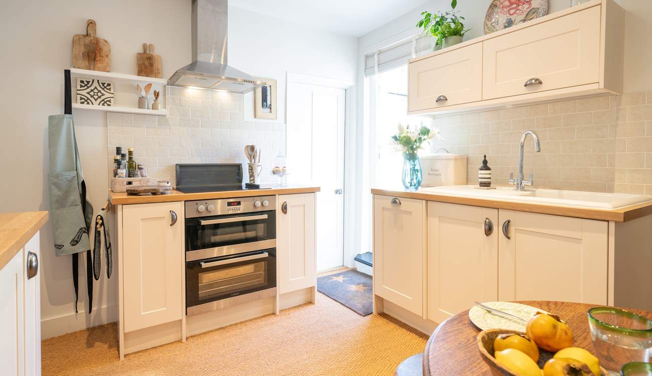 The kitchen/dining-room is modern and well-equipped for you to cook up a treat! 