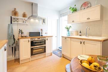 The kitchen/dining-room is modern and well-equipped for you to cook up a treat!