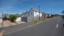 The property is located down a private road with parking for 1 car.