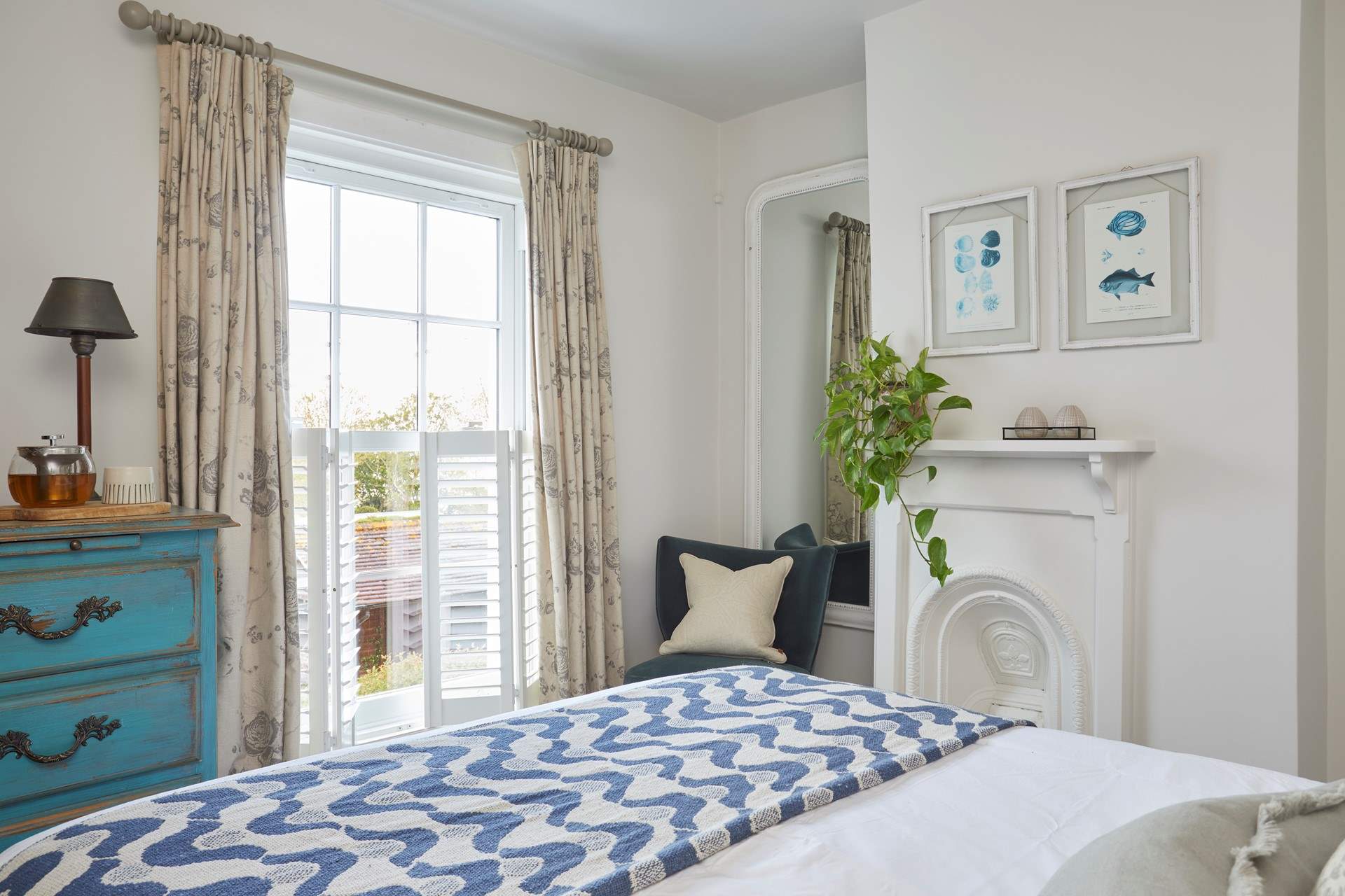 The stylish main bedroom on the first floor has wonderful sea views.