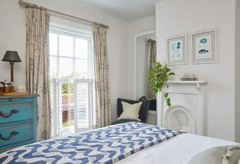 The stylish main bedroom on the first floor has wonderful sea views.