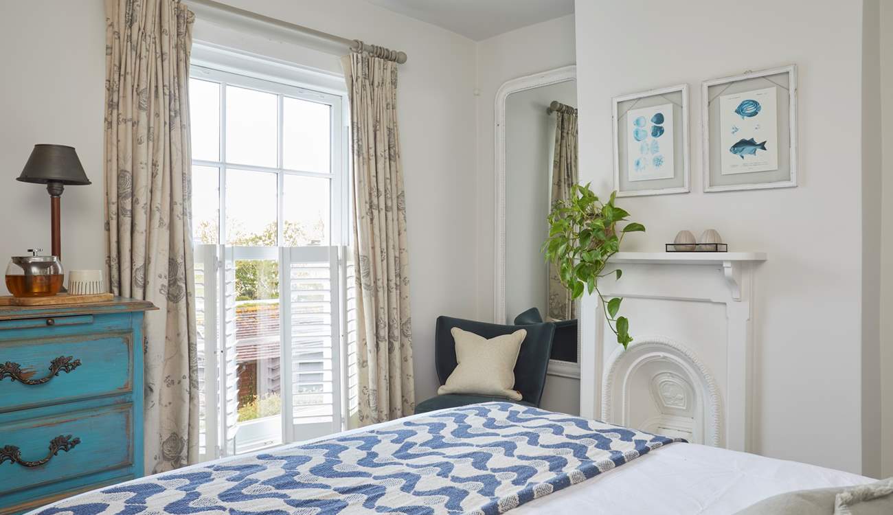 The stylish main bedroom on the first floor has wonderful sea views.