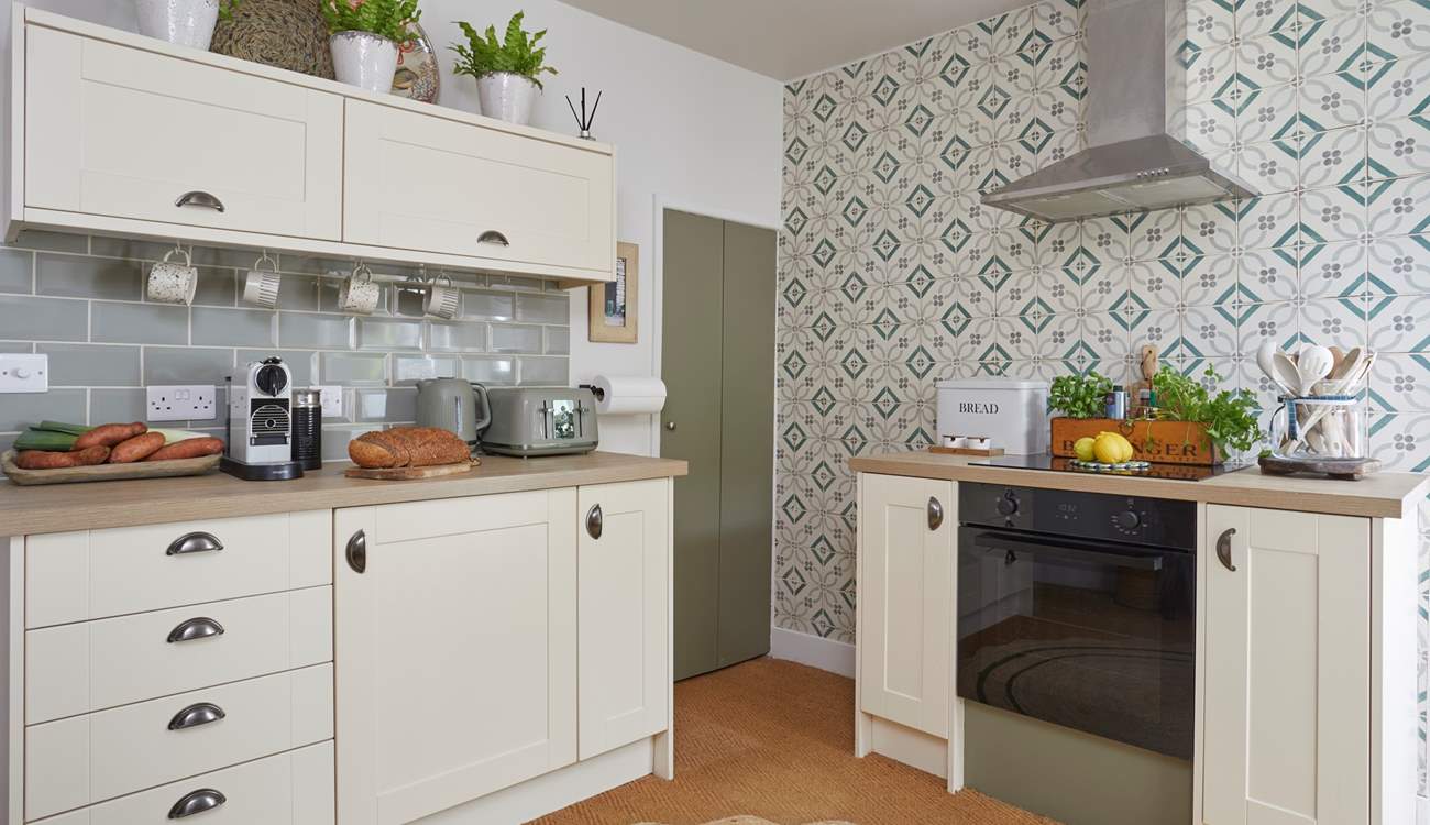 The kitchen/dining-room is modern and well-equipped for you to cook up a treat! 