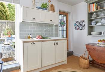 The beautiful cottage style kitchen opens up to the outside space.