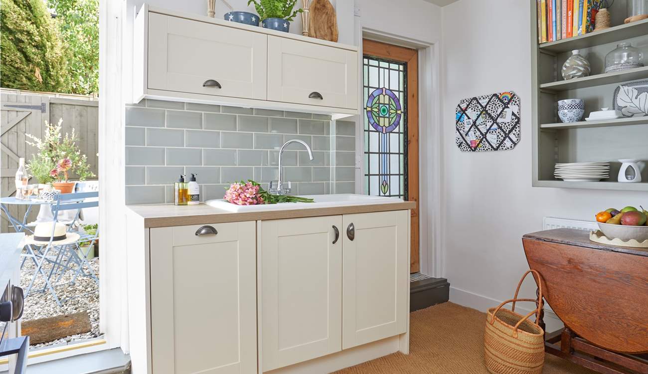 The beautiful cottage style kitchen opens up to the outside space.