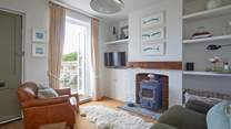 Relaxing in the cosy sitting-room and open the door to let the in the island sunshine.