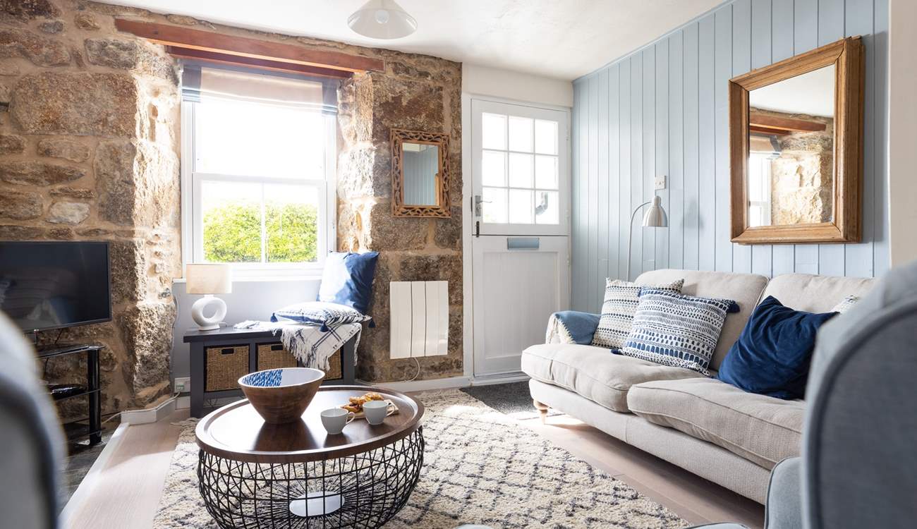 The stable-door opens to the outside patio, letting daylight flood in.