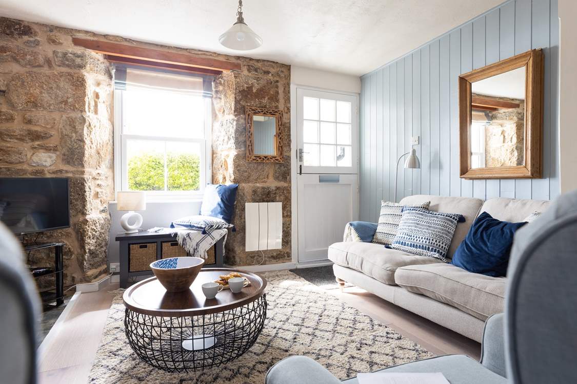The stable-door opens to the outside patio, letting daylight flood in.