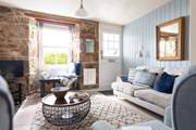 The stable-door opens to the outside patio, letting daylight flood in.