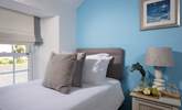 Pretty pastel shades await in the twin bedroom.  - Thumbnail Image