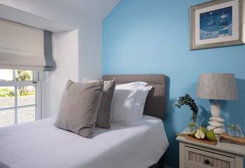 Pretty pastel shades await in the twin bedroom. 