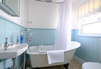 The family bathroom with super roll-top bath, perfect for a soak after a day at the beach.