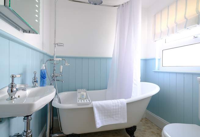 The family bathroom with super roll-top bath, perfect for a soak after a day at the beach.