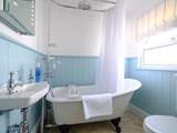 The family bathroom with super roll-top bath, perfect for a soak after a day at the beach.