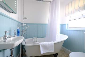 The family bathroom with super roll-top bath, perfect for a soak after a day at the beach.