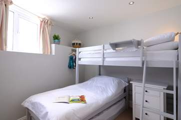 The twin room has bunk-beds and a truckle bed underneath if you don't wish to use the high bed, however this room is only suitable for two guests.