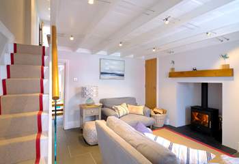 The staircase leads to the first floor from the sitting-room.