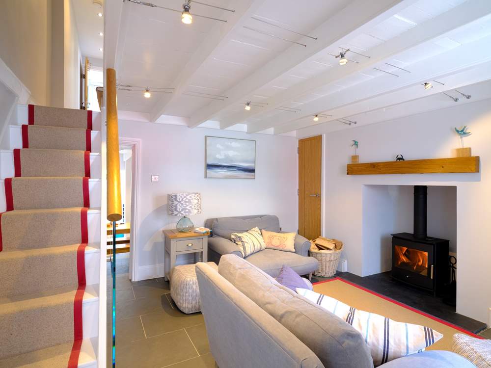 The staircase leads to the first floor from the sitting-room.