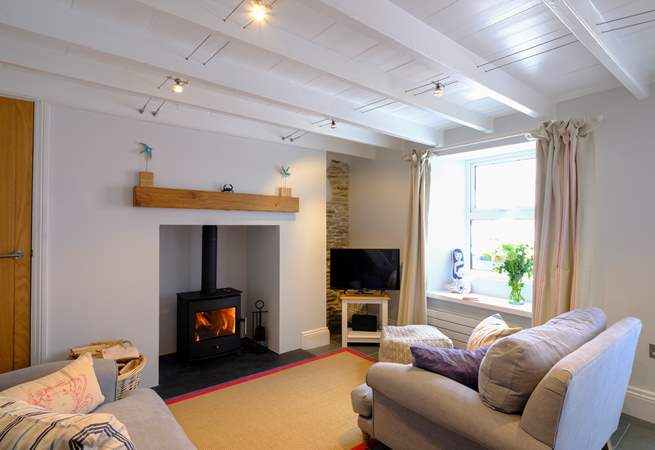 The super snug sitting-room with warming wood-burner to keep you warm in cooler months.