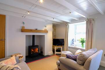 The super snug sitting-room with warming wood-burner to keep you warm in cooler months.