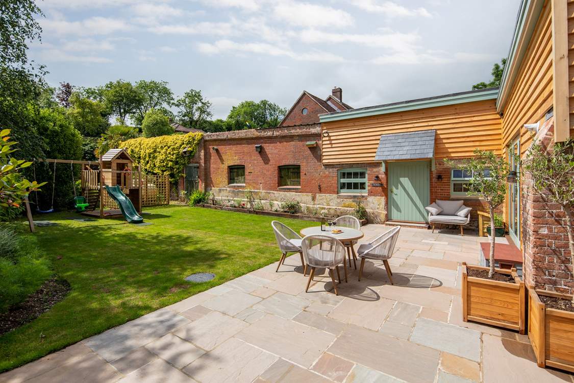 Sit back and relax on the patio where you can keep a close eye on little ones too. Please note that as of November 2021, the play equipment is being moved just the other side of the fence, in to the owners’ garden but will still be easily accessible.