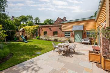 Sit back and relax on the patio where you can keep a close eye on little ones too. Please note that as of November 2021, the play equipment is being moved just the other side of the fence, in to the owners’ garden but will still be easily accessible.