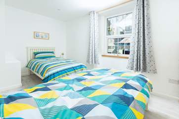 The twin room is light, attractive, and offers plenty of space for two.