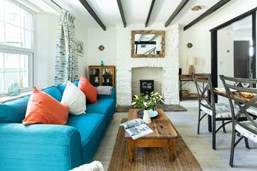 The living and dining area is compact yet snug and inviting. Flicking on the log- effect electric fire makes snuggling up a real treat.