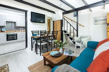 The downstairs cloakroom is just off the living-room (through the wooden door).