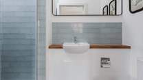 Both bedrooms have en suite shower-rooms.
