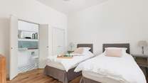 Bedroom 2 is light and airy.