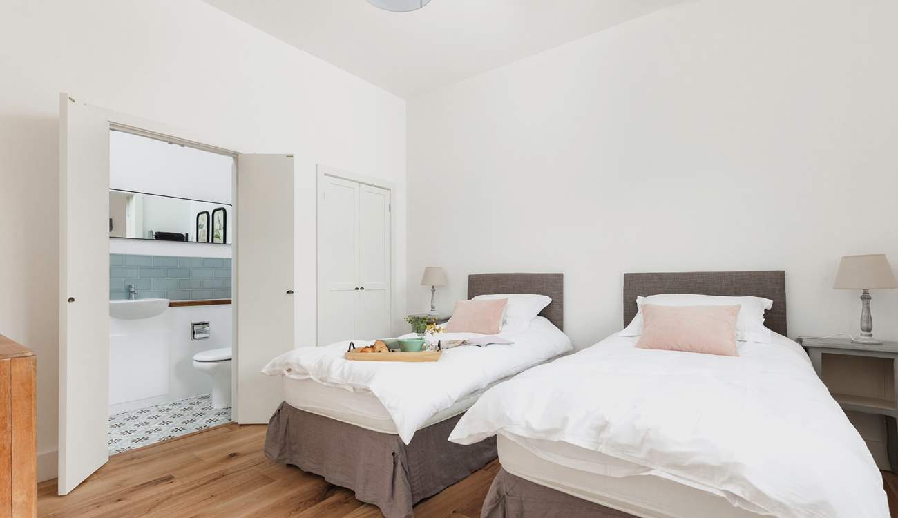 Bedroom 2 is light and airy.