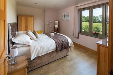 The main bedroom has fabulous countryside views and oodles of space.