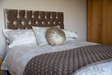 The beautiful main bedroom oozes style and comfort.