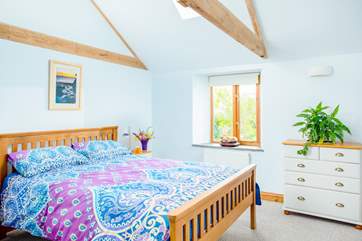 The light and spacious main bedroom with storage for your holiday belongings.