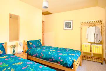 The twin bedroom with hanging storage.