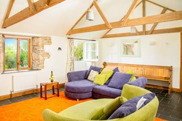 Time to get cosy in the wonderful rustic sitting-room after a day exploring.