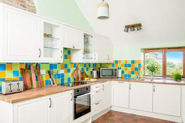 Cook up a feast in this well-equipped kitchen with a lovely view from the window.