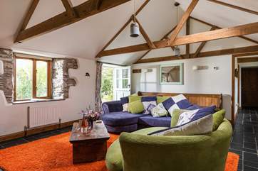 Time to get cosy in the wonderful rustic sitting-room after a day exploring.