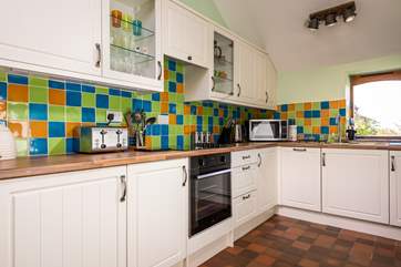 Cook up a feast in this well-equipped kitchen with a lovely view from the window.