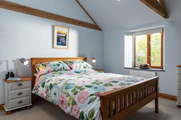 The light and spacious main bedroom with storage for your holiday belongings.