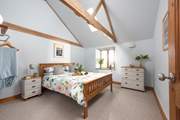 The light and spacious main bedroom with storage for your holiday belongings.