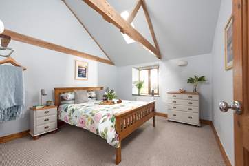 The light and spacious main bedroom with storage for your holiday belongings.