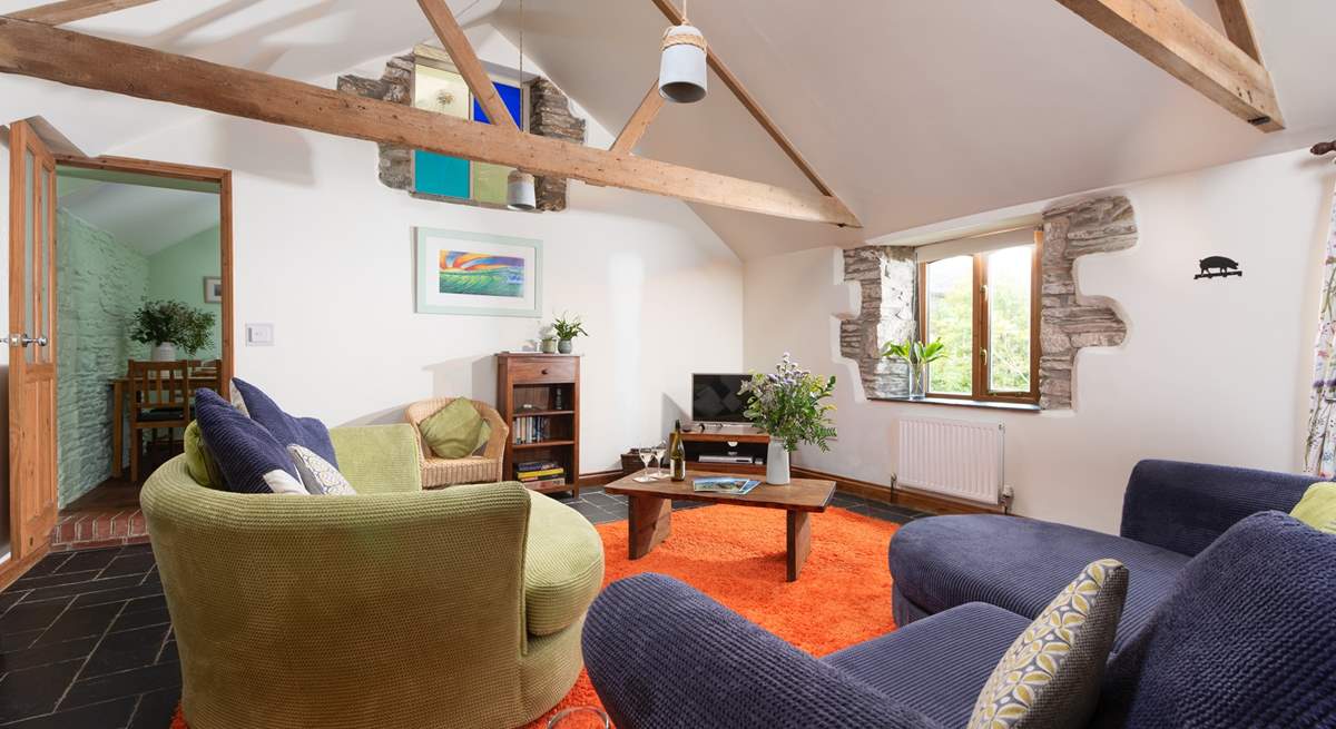 The beautiful rustic beams and stone walls make for a cosy living area.