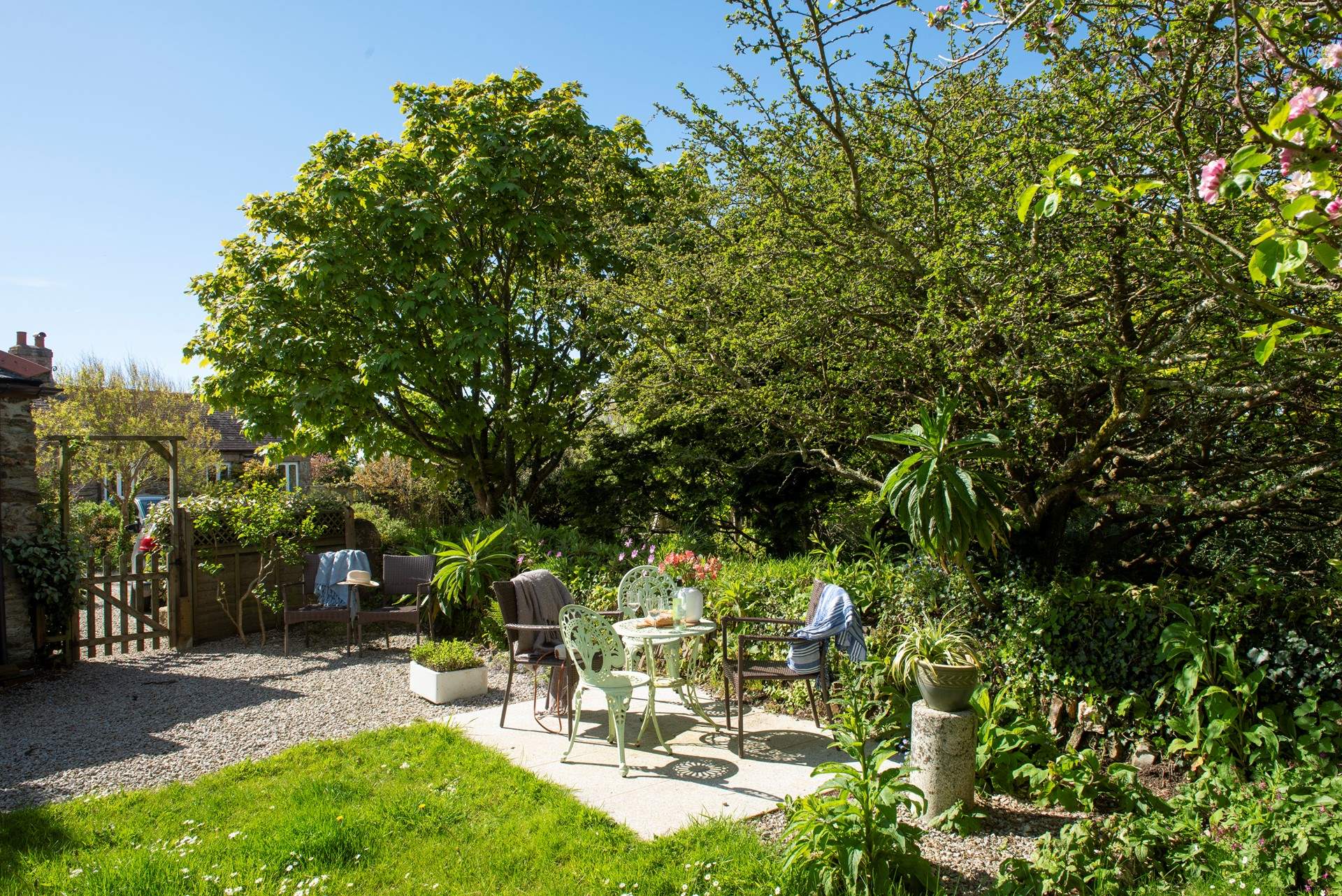 The pretty garden is the perfect spot to unwind after a day out and about. 