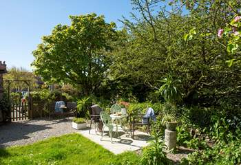 The pretty garden is the perfect spot to unwind after a day out and about. 