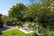 The pretty garden is the perfect spot to unwind after a day out and about.