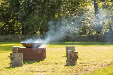 An impressive fire-pit to cosy up by as the night draws in.